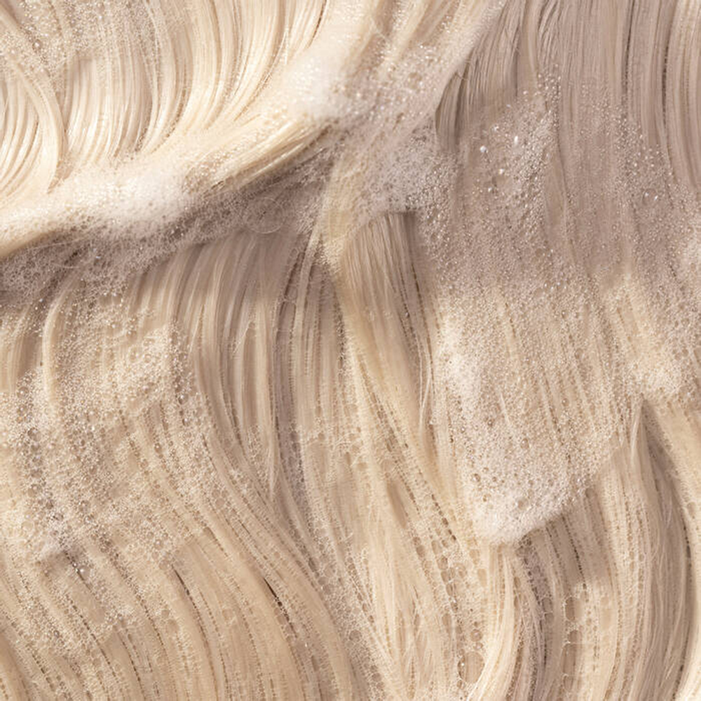 Champú Pureology Pure Volume de 266 ml: cuerpo ligero y volumen para cabello fino y teñido.