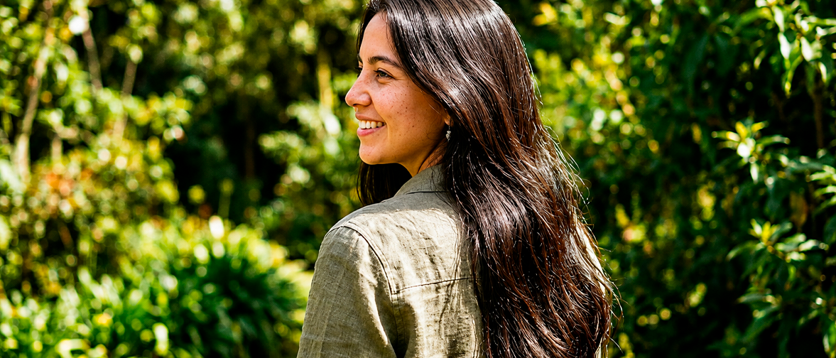 Woman comparing hair growth supplements and vitamins for healthier hair
